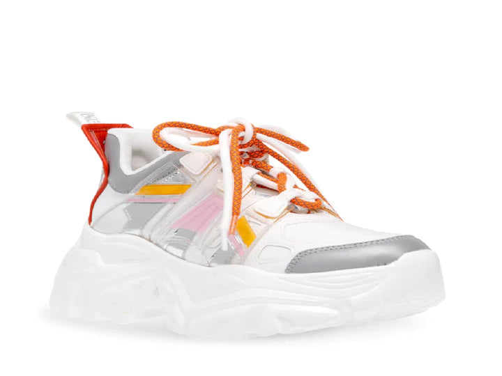 Tenis Steve Madden Riptid en color blanco y plata con detalles en naranja y amarillo, suela ancha y estilo chunky.