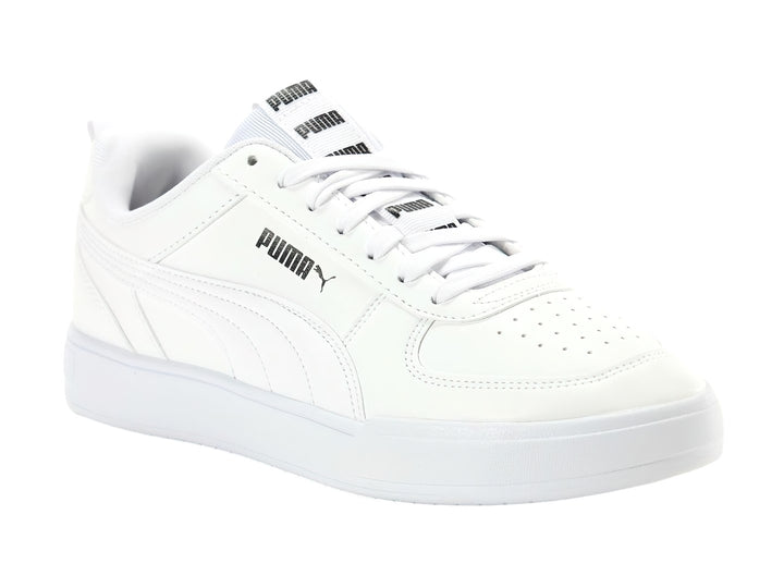 Tenis PUMA Caven Tape color blanco con suela blanca y detalles de marca en negro.