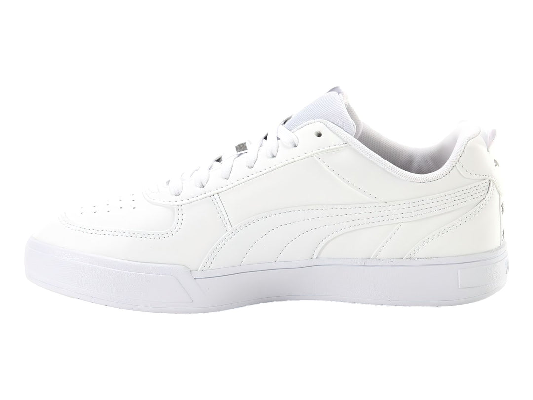 Tenis PUMA Caven Tape color blanco con suela blanca y detalles de marca en negro.