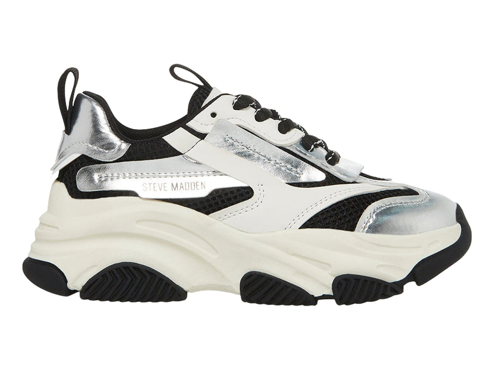 Tenis deportivos chunky para niños en colores blanco, negro y plateado metálico con suela ancha.