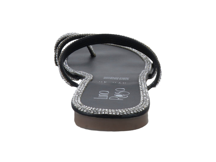 Sandalia plana color negro con tiras decoradas con piedras brillantes color plata.