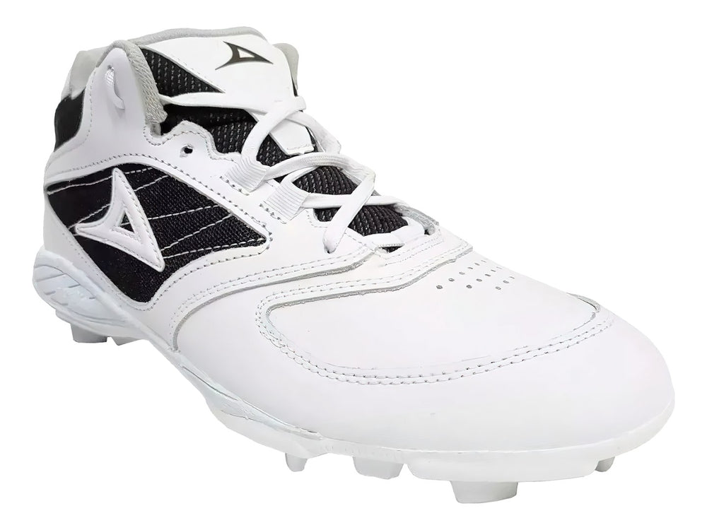 Zapato de béisbol marca Pirma en colores blanco y negro con suela de tacos.