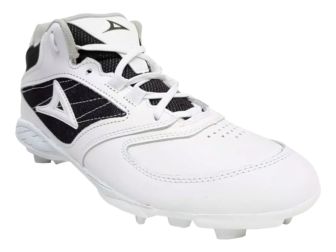 Zapato de béisbol marca Pirma en colores blanco y negro con suela de tacos.