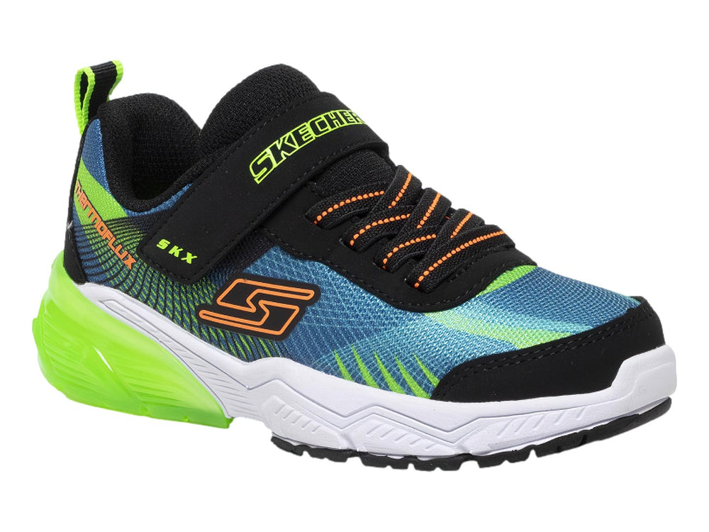 Tenis deportivos SKECHERS para niño en colores azul, verde neón y negro con cierre de velcro.