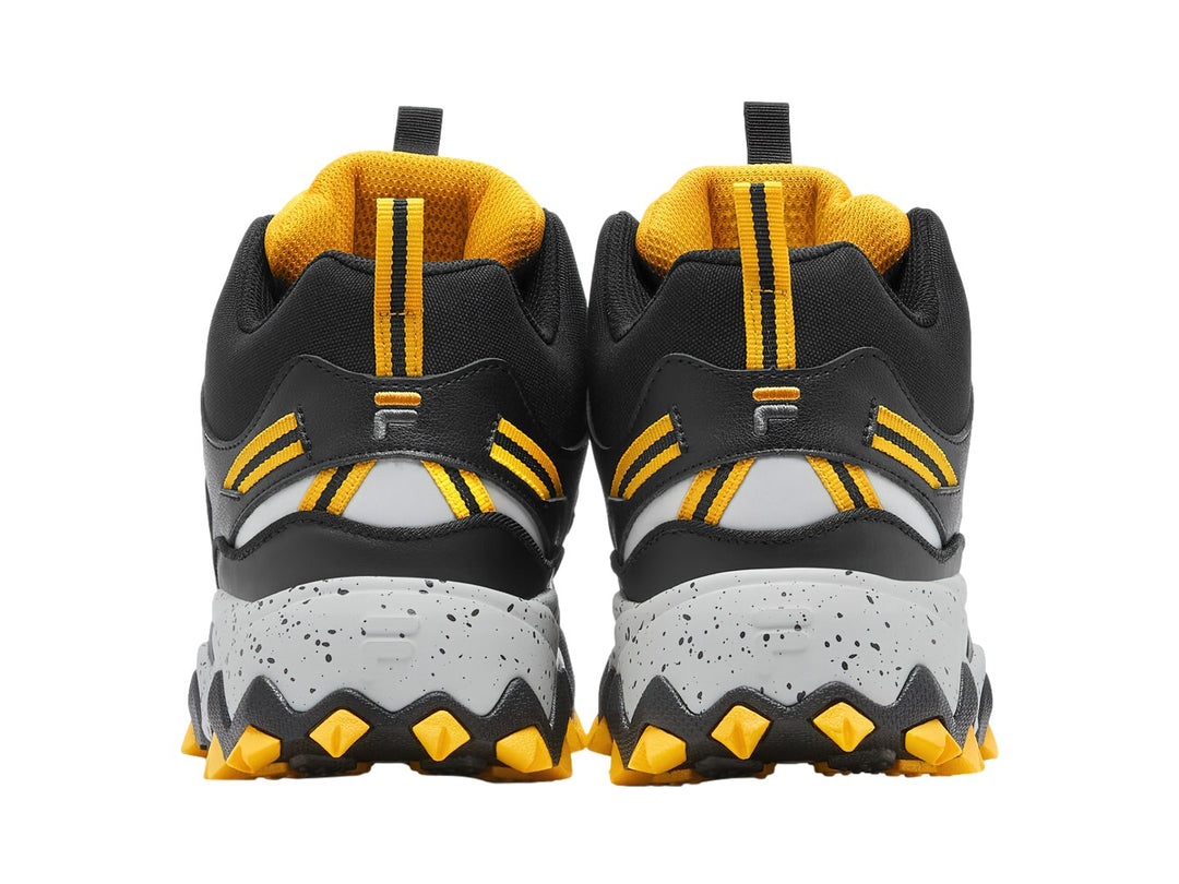 Tenis FILA Oakmont-TR Mid en colores amarillo, negro y gris con suela gruesa y robusta.