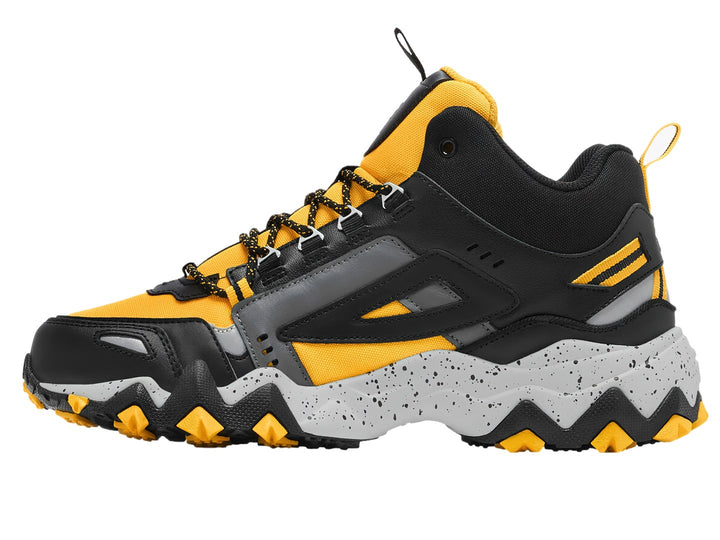Tenis FILA Oakmont-TR Mid en colores amarillo, negro y gris con suela gruesa y robusta.