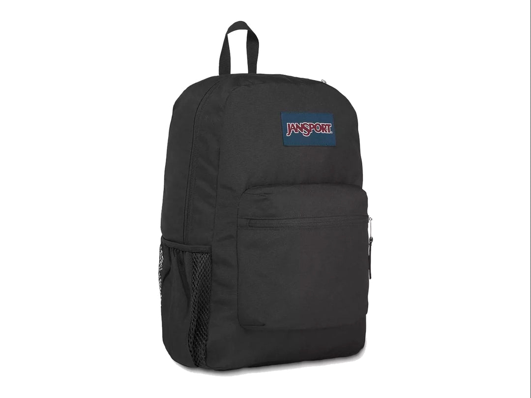 Mochila escolar JanSport color negro con un bolsillo frontal con cierre y un compartimento lateral para botella.