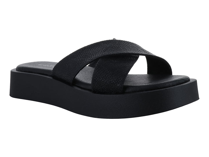 Sandalia de plataforma color negro con tiras cruzadas y suela gruesa.