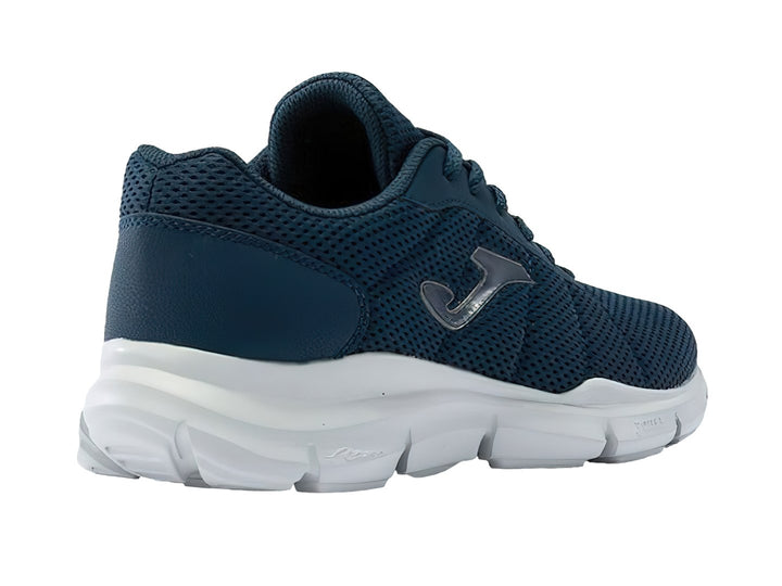 Tenis deportivos Joma color azul marino con suela blanca y tejido de malla.