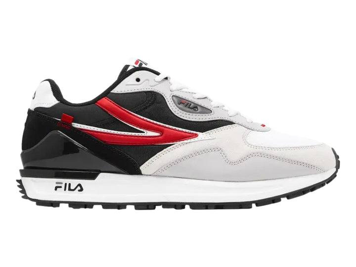 Tenis deportivos FILA en colores blanco y negro con una franja roja lateral y suela blanca.