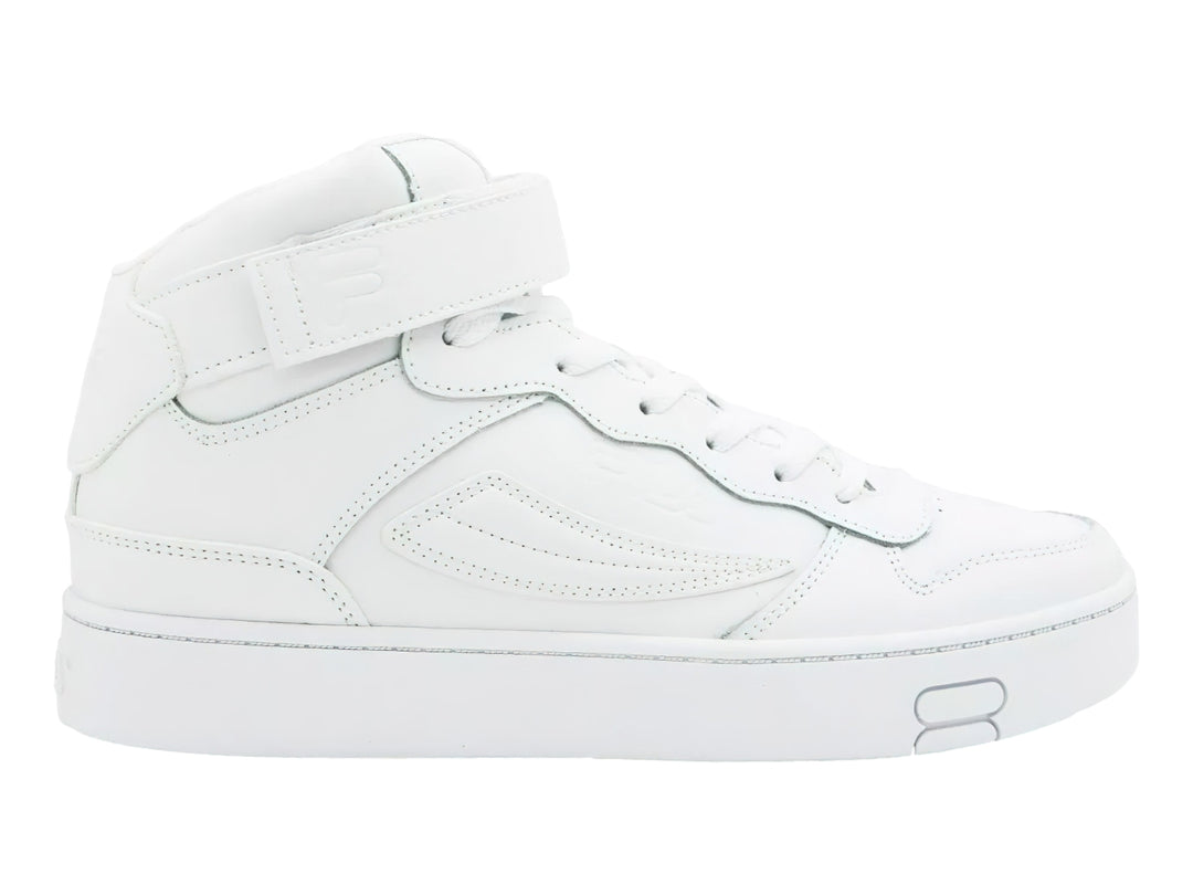 Tenis FILA MGX-100 Mid en color blanco total con correa de velcro y suela ancha.