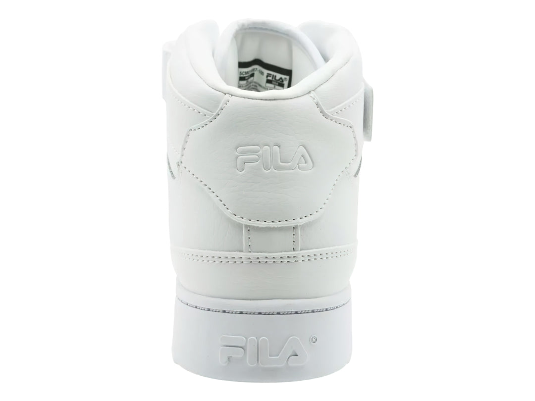 Tenis FILA MGX-100 Mid en color blanco total con correa de velcro y suela ancha.