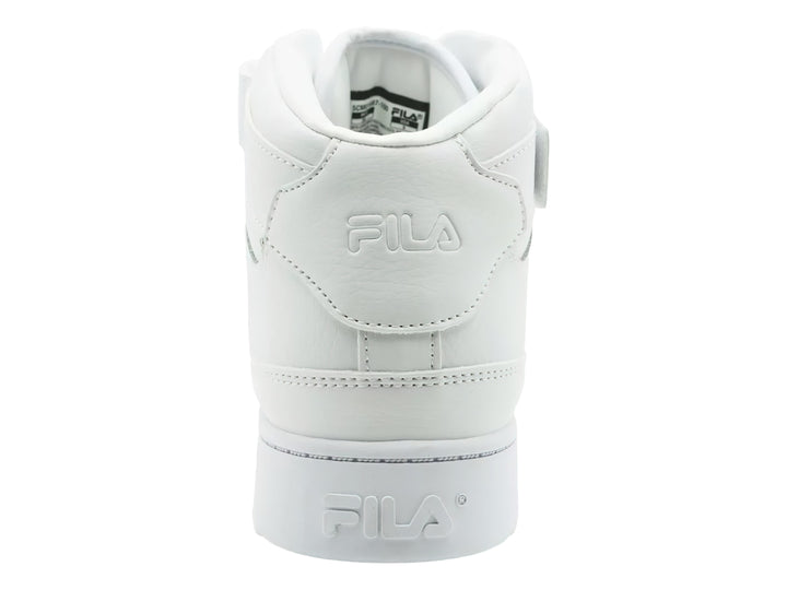 Tenis FILA MGX-100 Mid en color blanco total con correa de velcro y suela ancha.