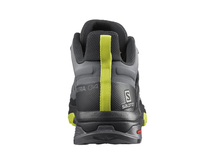 Zapato de senderismo Salomon X Ultra 4 Mid GTX en colores gris y negro con detalles en amarillo neón.