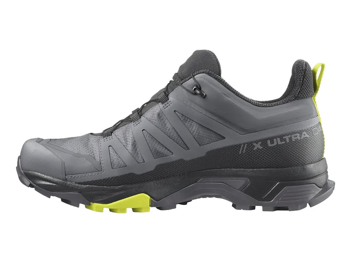 Zapato de senderismo Salomon X Ultra 4 Mid GTX en colores gris y negro con detalles en amarillo neón.