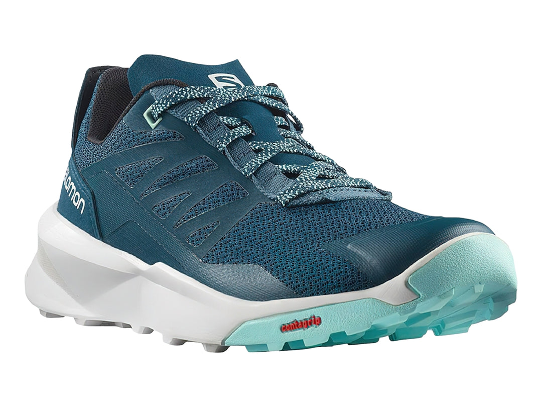 Zapato deportivo Salomon Patrol color azul con suela blanca y detalles en verde menta.