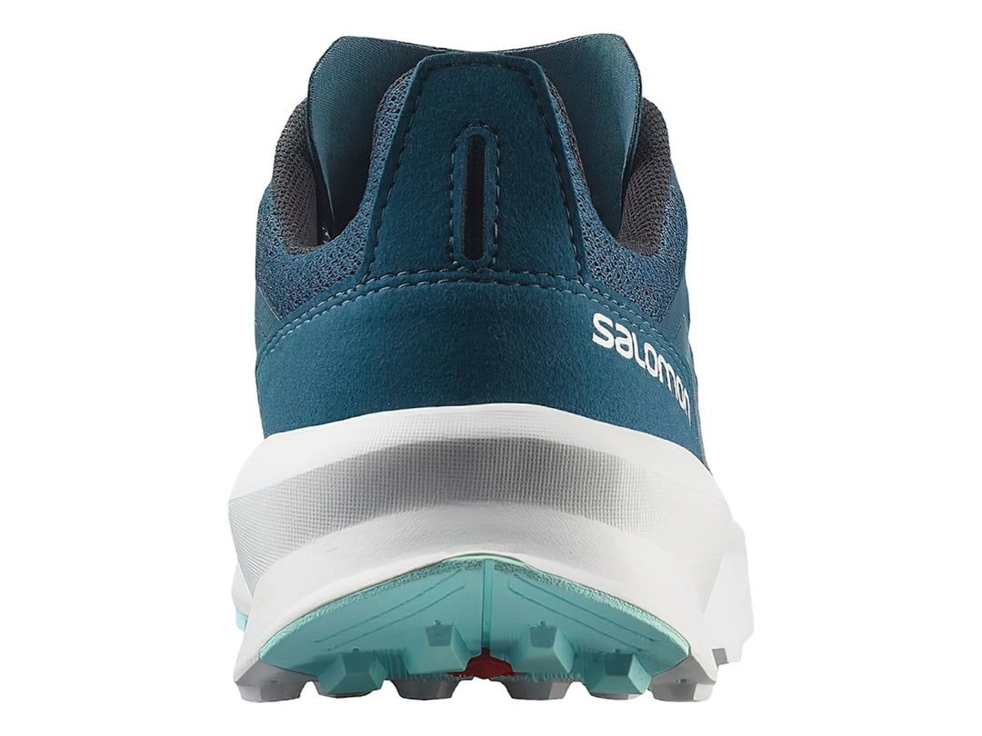 Zapato deportivo Salomon Patrol color azul con suela blanca y detalles en verde menta.