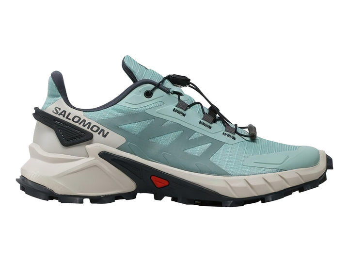Tenis deportivos Salomon Supercross 4 color verde azulado con suela robusta en tonos gris y negro.