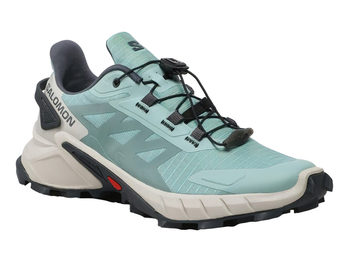 Tenis deportivos Salomon Supercross 4 color verde azulado con suela robusta en tonos gris y negro.