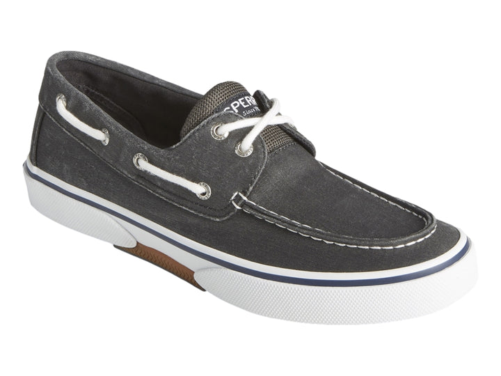 Zapato náutico Sperry de color negro lavado con suela blanca y agujetas blancas.