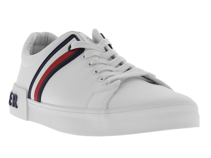 Tenis Tommy Hilfiger color blanco con franjas laterales en azul y rojo y suela blanca.