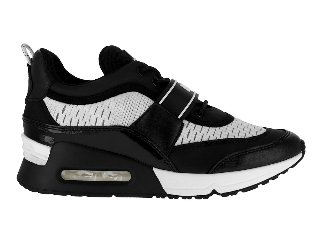 Tenis DKNY color blanco y negro con correa ajustable y suela con amortiguación.
