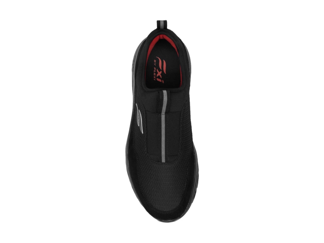 Zapato deportivo Flexi color negro, diseño sin cordones con suela amortiguada y tejido transpirable.