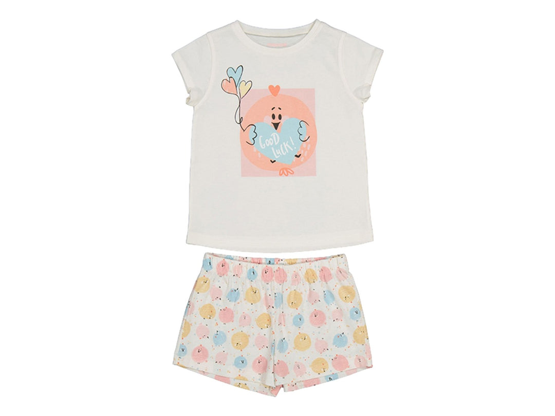 Pijama para niña color crema con camiseta de manga corta y short estampado.