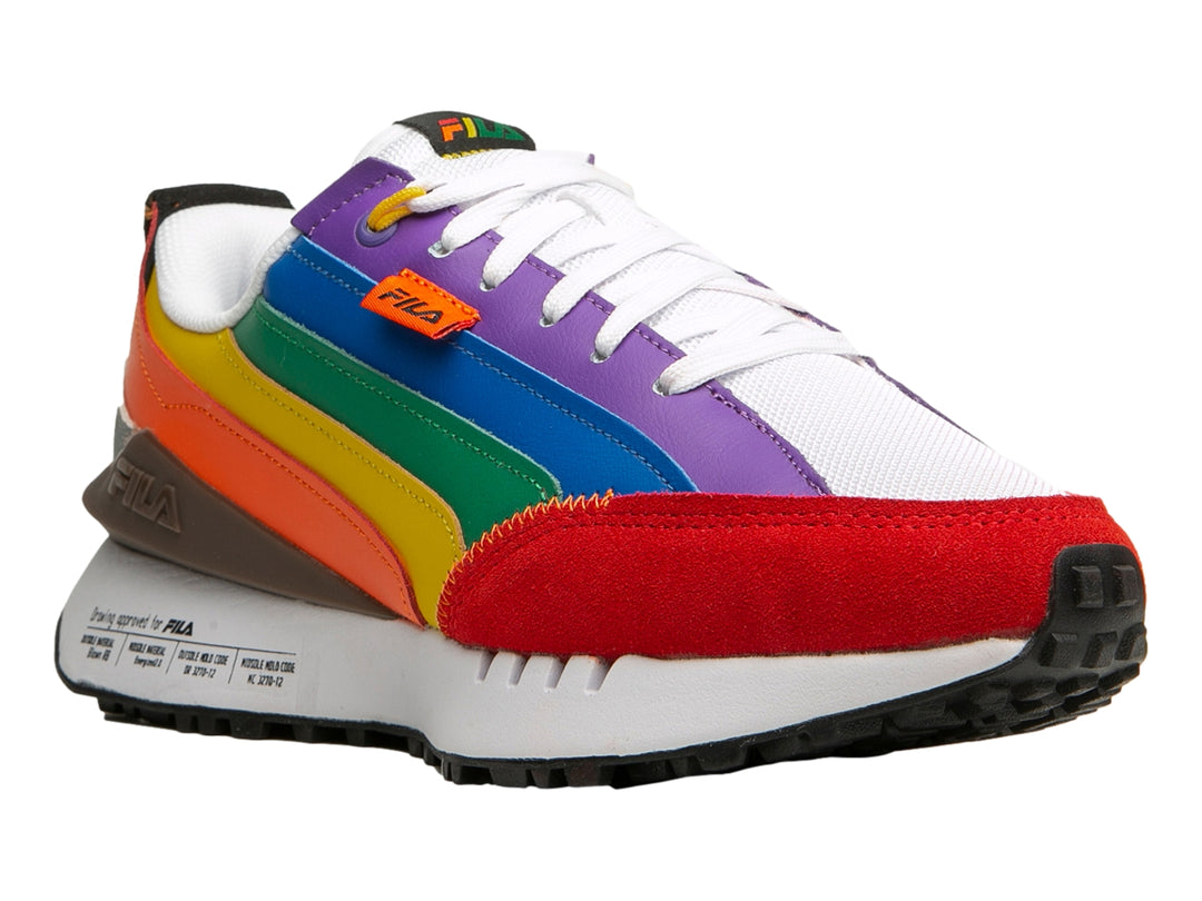 Tenis FILA Renno Generation Pride con franjas multicolores estilo arcoíris, punta roja y suela blanca.