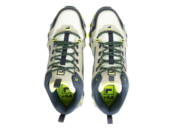 Tenis FILA Oakmont TR Mid color gris y azul con detalles amarillo neón y suela gruesa moteada.