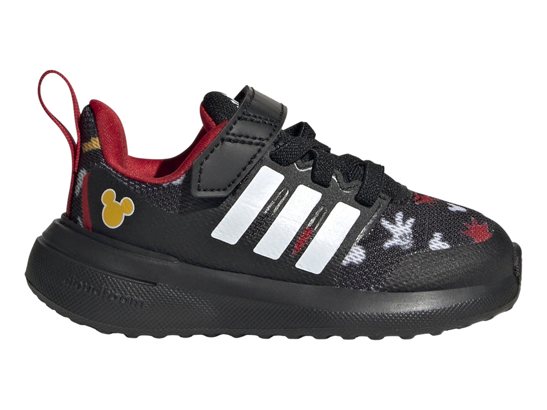 Tenis deportivos Adidas negros para niño con detalles de Mickey Mouse, rayas blancas y cierre de velcro.
