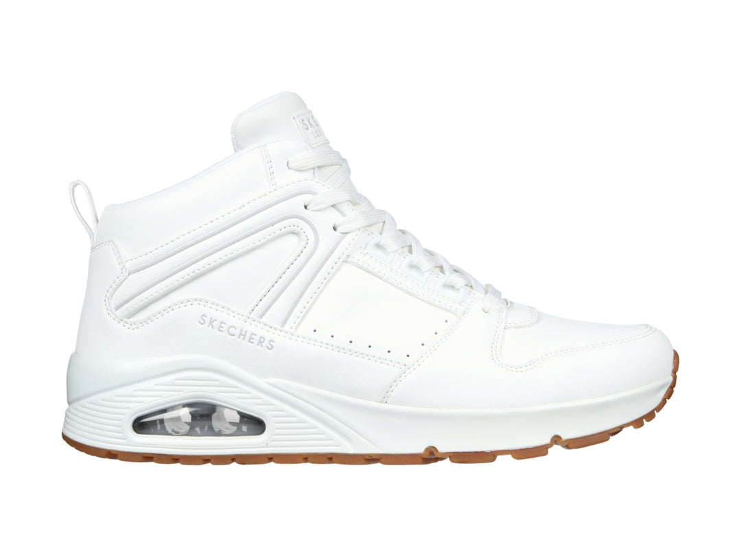 Tenis Skechers blancos de cuello alto con suela color café y cámara de aire visible en el talón.