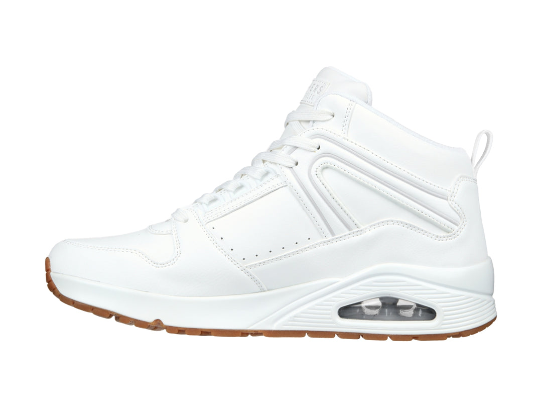 Tenis Skechers blancos de cuello alto con suela color café y cámara de aire visible en el talón.