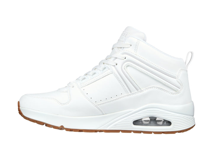 Tenis Skechers blancos de cuello alto con suela color café y cámara de aire visible en el talón.