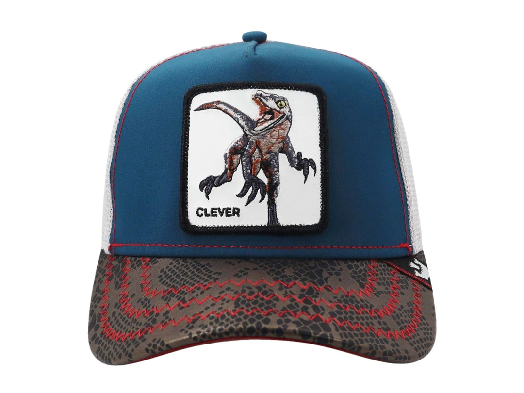 Gorra Goorin Bros azul y gris con estampado de piel de reptil y parche de dinosaurio.