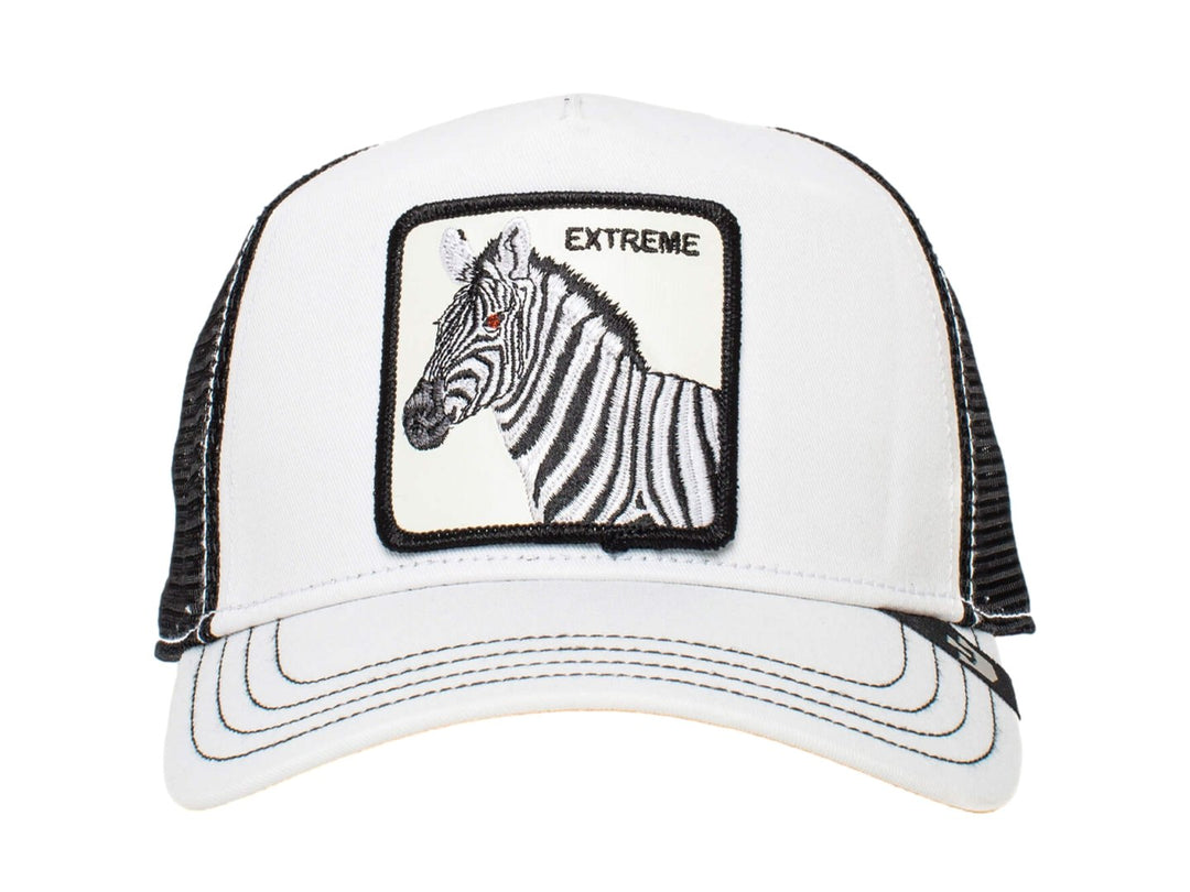 Gorra blanca Goorin Bros con malla negra y un parche frontal de una cebra con la palabra EXTREME.