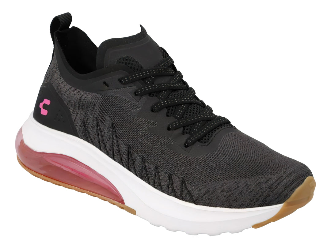 Tenis deportivos Charly color negro con suela blanca y detalles en fucsia.