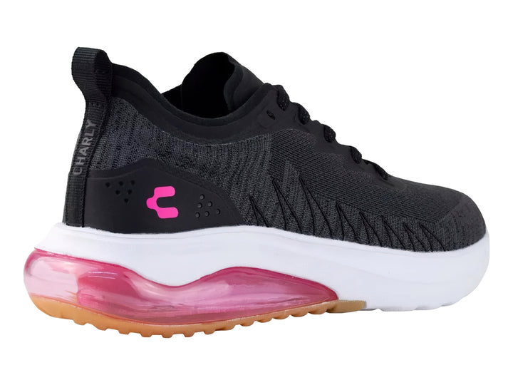 Tenis deportivos Charly color negro con suela blanca y detalles en fucsia.