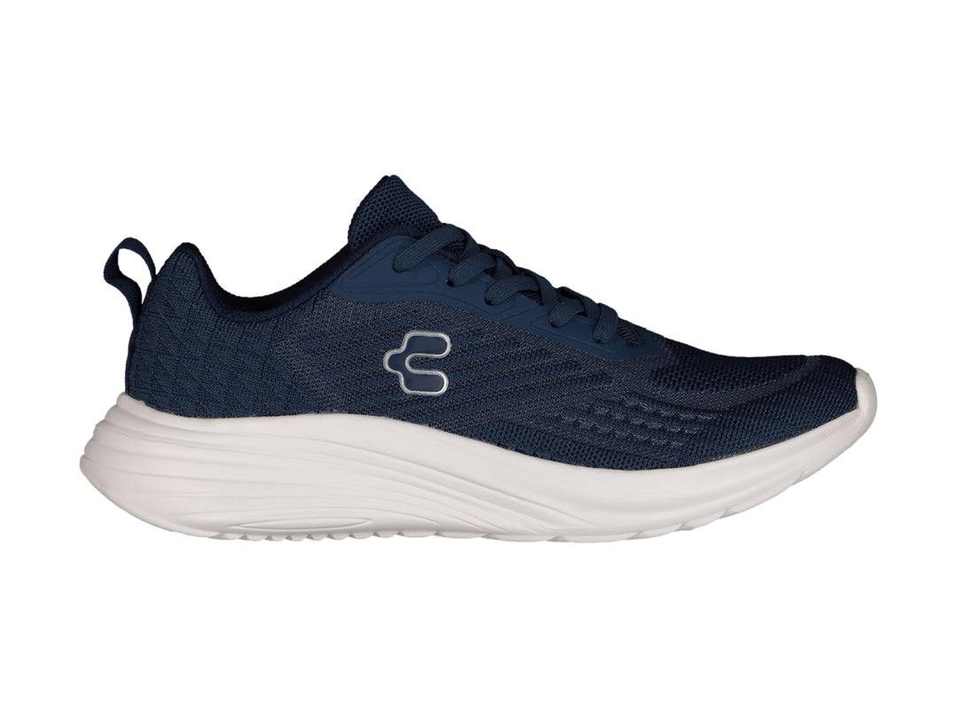 Tenis deportivos Charly color azul marino con suela blanca y logotipo blanco.
