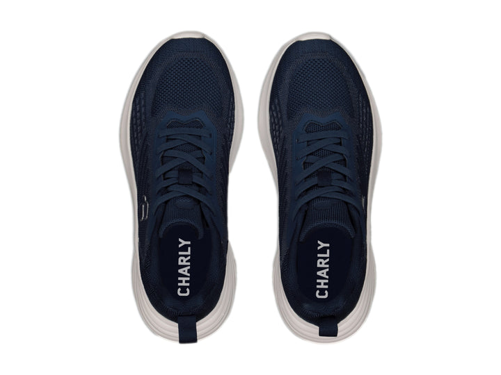 Tenis deportivos Charly color azul marino con suela blanca y logotipo blanco.