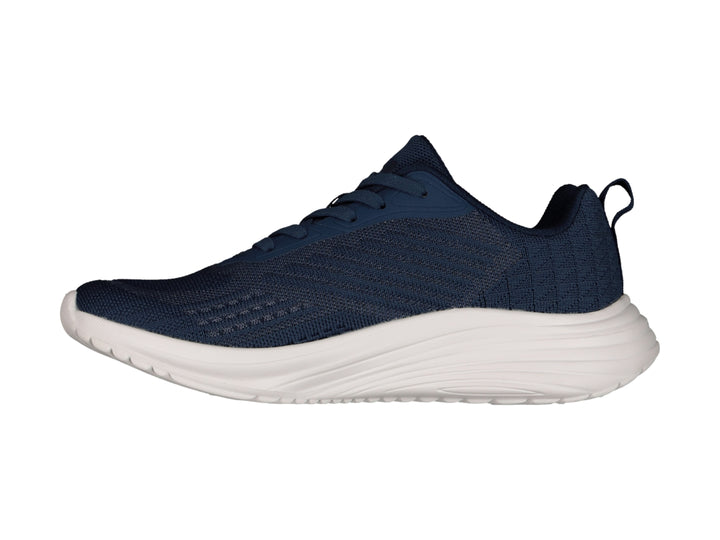 Tenis deportivos Charly color azul marino con suela blanca y logotipo blanco.