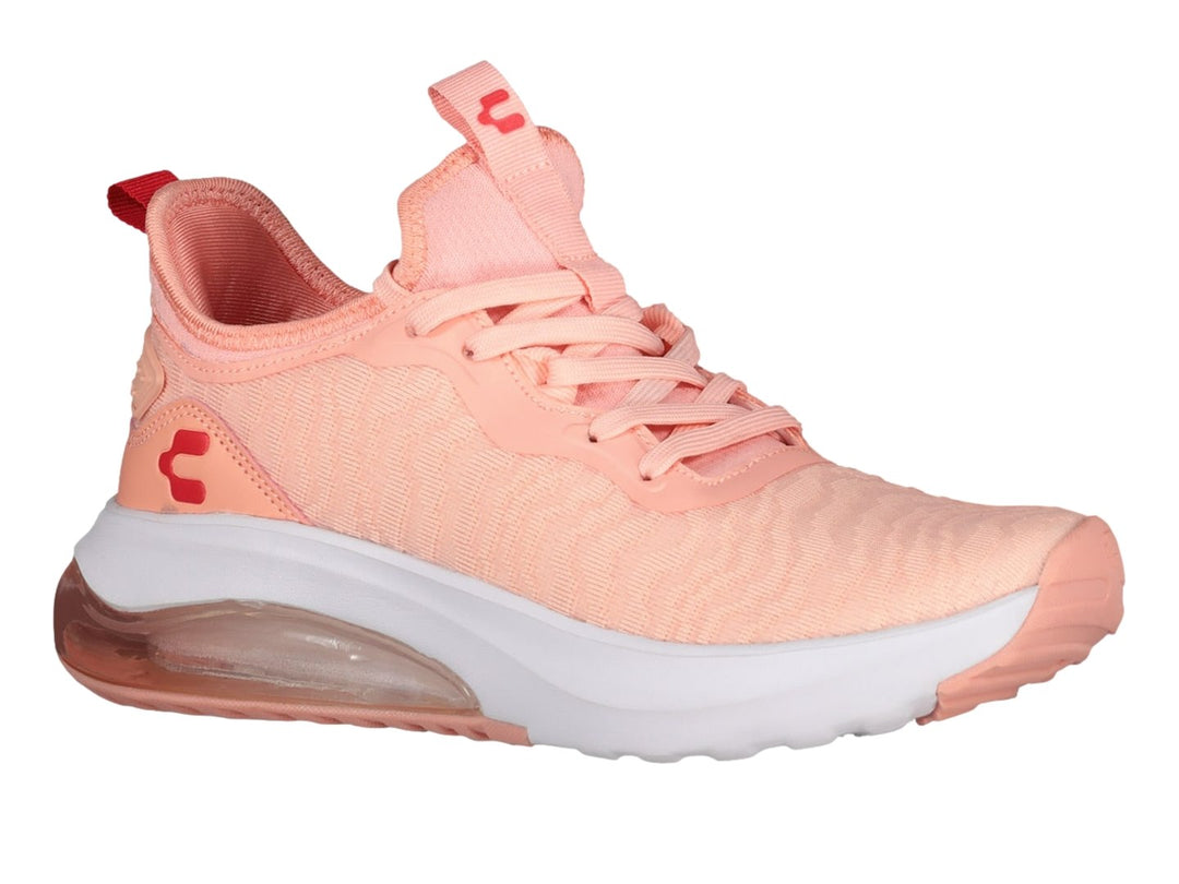 Tenis deportivos Charly en color rosa con suela blanca y cámara de aire visible.