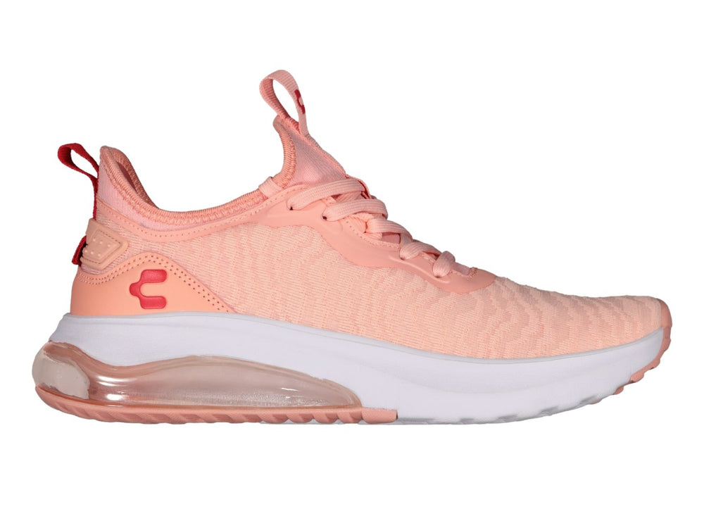 Tenis deportivos Charly en color rosa con suela blanca y cámara de aire visible.