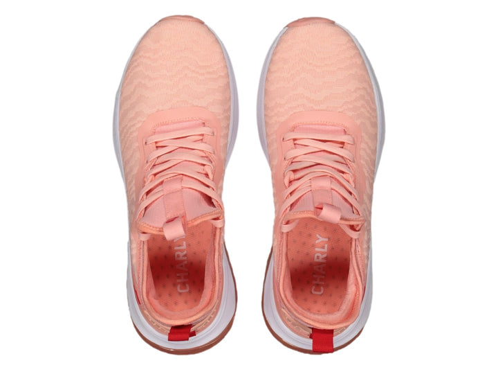 Tenis deportivos Charly en color rosa con suela blanca y cámara de aire visible.