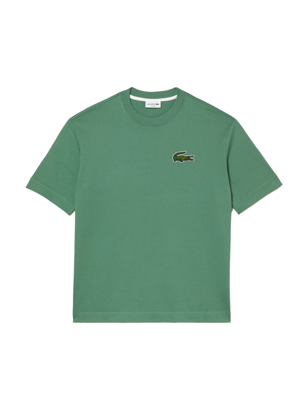 Camiseta de manga corta color verde con logo de cocodrilo en el pecho izquierdo.