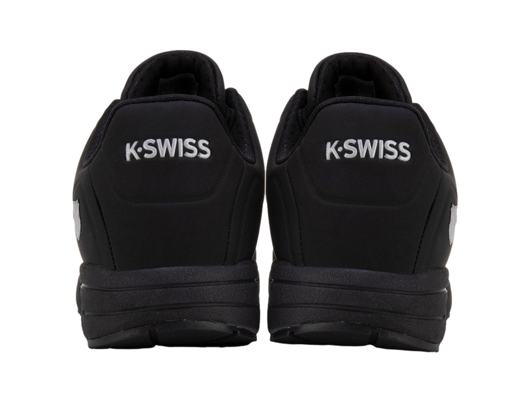 Tenis deportivos K-Swiss color negro monocromático con detalle de amortiguación visible en la suela.
