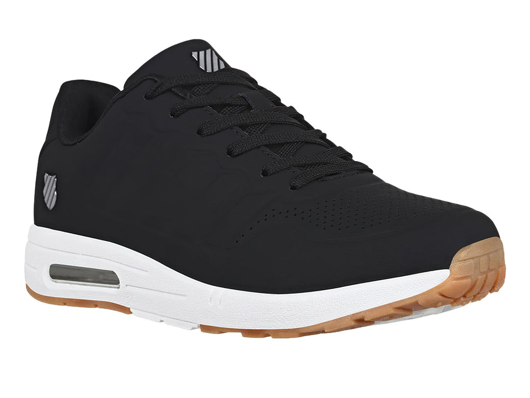 Tenis K-Swiss color negro con suela blanca y detalles en café, diseño deportivo para mujer.