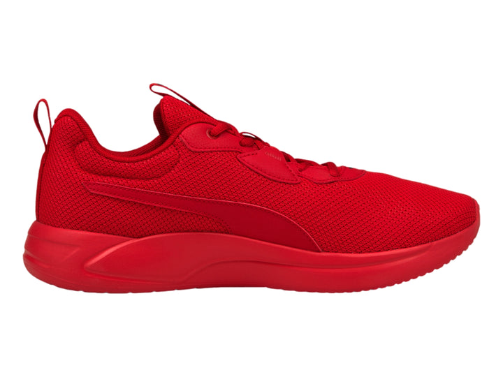 Tenis deportivos PUMA de color rojo intenso con suela a juego y tejido de malla.