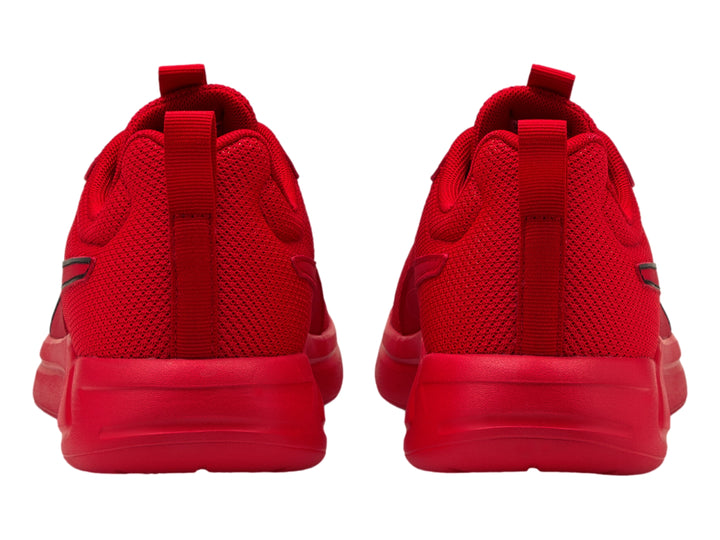Tenis deportivos PUMA de color rojo intenso con suela a juego y tejido de malla.