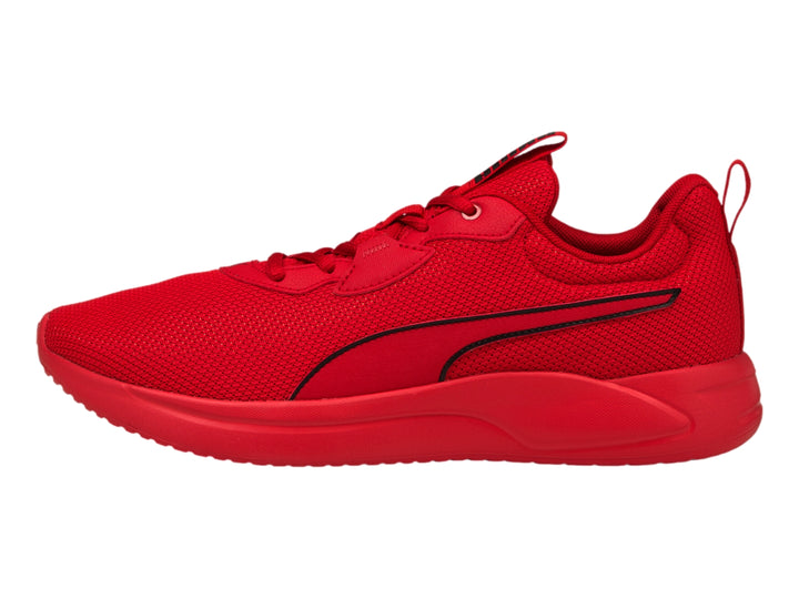 Tenis deportivos PUMA de color rojo intenso con suela a juego y tejido de malla.